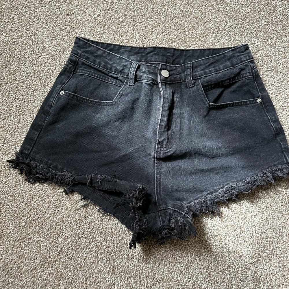 Lightly distressed black denim shorts